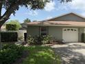 Charming home with a single-car garage and a well-manicured lawn with established landscaping at 4176 Center Pointe Cir # 70A, Sarasota, FL 34233