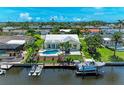 Aerial view of home showcasing a private pool, boat dock, and waterfront access at 4508 Mangrove Point Rd, Bradenton, FL 34210