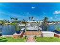 Private boat dock with boat lift offering direct access to the open waters at 4508 Mangrove Point Rd, Bradenton, FL 34210