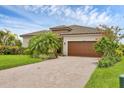 Charming single-story home featuring a brick paved driveway and tropical landscaping in a community at 4524 Baltry Ct, Bradenton, FL 34211