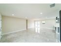 Bright and airy living room features tile floors, recessed lighting, and neutral walls at 4616 34Th E Ave, Bradenton, FL 34208