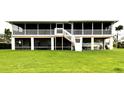 Spacious screened porch overlooking lush green lawn at 5111 Bay State Rd, Palmetto, FL 34221