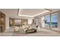 Open-concept living room with light wood finishes and expansive water views from the patio at 555 Quay Commons # 1402, Sarasota, FL 34236