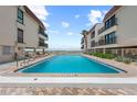Beautiful beachfront pool and lounge area between condominium buildings at 5806 Gulf Dr # 201, Holmes Beach, FL 34217