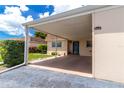 Exterior view showcasing the covered carport and home entrance, offering convenient parking and shelter at 643 Park Cir, Bradenton, FL 34207