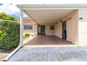 Wide shot of the covered carport with space for parking, with an adjacent storage area at 643 Park Cir, Bradenton, FL 34207
