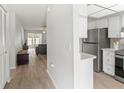 Bright condo featuring an updated kitchen with stainless steel refrigerator and an open concept floor plan at 643 Park Cir, Bradenton, FL 34207