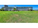 Beautiful multi-story condo building with well-manicured lawn and direct access to outdoor amenities at 767 John Ringling Blvd # 25, Sarasota, FL 34236
