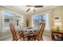 Bright dining area with decorative tablecloth and natural lighting at 1116 S Moonmist Ct # M12, Sarasota, FL 34242