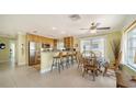 Bright eat-in kitchen with wood cabinets, granite countertops, and stainless steel appliances at 1116 S Moonmist Ct # M12, Sarasota, FL 34242