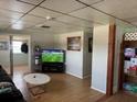 Cozy living room with a large TV and open access to other rooms at 1506 S 78Th S St, Tampa, FL 33619