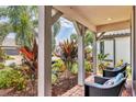 Cozy front patio with comfortable seating and views of the beautiful landscaping at 17910 Waterville Pl, Lakewood Ranch, FL 34202