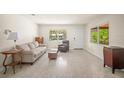 Cozy living room featuring neutral walls, and comfortable seating at 2275 Clematis St, Sarasota, FL 34239