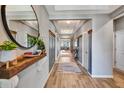 Bright hallway features wood floors and stylish decor at 3218 Big Sky Way, Bradenton, FL 34211