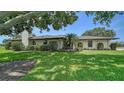 Charming home featuring mature landscaping and a lush green lawn, creating a welcoming and picturesque setting at 3734 Ballantrae Dr # 19D, Sarasota, FL 34238