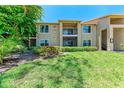 Charming two-story condo featuring well-maintained landscaping and outdoor spaces with stairs at 4057 Crockers Lake Blvd # 15, Sarasota, FL 34238