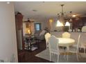Inviting living space with dining area, comfortable seating and view of the kitchen at 4057 Crockers Lake Blvd # 15, Sarasota, FL 34238