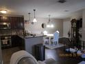 Combination living space showcasing the kitchen, dining area, and living room at 4057 Crockers Lake Blvd # 15, Sarasota, FL 34238
