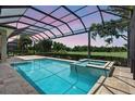 A screened-in pool with an attached spa provides a serene outdoor retreat at 4931 Benito Ct, Bradenton, FL 34211