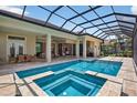 A screened-in pool with an attached spa provides a serene outdoor retreat at 4931 Benito Ct, Bradenton, FL 34211