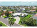 Aerial view of waterfront property with canal access and views of the surrounding neighborhood at 510 Wedge Ln, Longboat Key, FL 34228