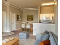 Inviting living area featuring a dining table, comfortable seating and an open layout with a kitchen view at 5146 Northridge Rd # 310, Sarasota, FL 34238