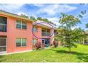 Condo with a screened balcony overlooking a lush green backyard at 5500 Longwood Run Blvd # 203, Sarasota, FL 34243