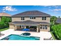 Expansive backyard featuring a sparkling pool, brick-paved patio, and outdoor dining area perfect for entertaining at 6302 Anise Dr, Sarasota, FL 34238