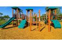 Colorful community playground featuring slides and climbing structures at 6731 Washington Pl, Bradenton, FL 34207