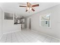 Inviting open-concept living room with tile floors, and bright natural light at 8075 48Th N Ave, St Petersburg, FL 33709