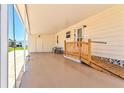 Covered parking area featuring an accessible ramp and seating at 830 Trento Dr, Venice, FL 34285