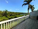 Relaxing deck with a scenic view of lush greenery and serene waterways at 967 Waterside Ln # 1, Bradenton, FL 34209