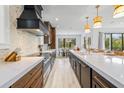 Modern kitchen with an island, premium appliances, and stylish fixtures and finishes at 128 Fillmore Dr, Sarasota, FL 34236