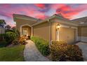 Charming single-story home entrance with stone walkway and well-maintained landscaping at 2070 Crystal Lake Trl, Bradenton, FL 34211