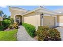 Charming single-story home entrance with stone walkway and well-maintained landscaping at 2070 Crystal Lake Trl, Bradenton, FL 34211
