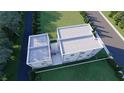 Aerial view of a modern home with flat roofs, a white picket fence and a lush green lawn at 2144 5Th N Ave, St Petersburg, FL 33713