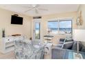 Cozy living room featuring a serene ocean view, comfortable seating, and a beachy decor at 2310 Gulf N Dr # 104, Bradenton Beach, FL 34217