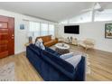 Comfortable living room featuring modern furnishings, a large TV, and bright natural light at 2933 Michigan St, Sarasota, FL 34237