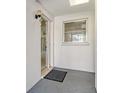 Welcoming entrance showcasing a sleek door and a well-lit entryway at 3276 Westford Ln, #117,, Sarasota, FL 34231