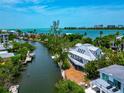Aerial view of waterfront home with private boat dock and stunning ocean views at 3737 Bayou Louise Ln, Sarasota, FL 34242