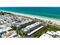 Aerial shot of condos featuring beach access, well-maintained grounds, and ample parking at 3802 Gulf Of Mexico Dr # A205, Longboat Key, FL 34228