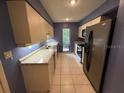 Bright kitchen features granite countertops, stainless steel appliances, and ample cabinet space at 5032 81St Avenue E Ter, Sarasota, FL 34243
