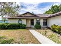 Inviting home exterior featuring a neatly landscaped front yard and a welcoming entrance at 5213 20Th Street E Ct, Bradenton, FL 34203