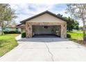 Spacious two-car garage with stone accents, offering ample parking and storage space at 5213 20Th Street E Ct, Bradenton, FL 34203