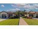 Beautiful exterior view of a home with meticulous landscaping and inviting curb appeal at 5604 Palmer Cir # 103, Bradenton, FL 34211