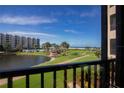 Beautiful ocean view from the balcony of this home, overlooking a pond and the white sands of the beach at 5750 Midnight Pass Rd # 203, Sarasota, FL 34242