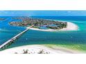 Breathtaking aerial view showcasing the coastline, bridge, and turquoise ocean waters at 681 Fox St, Longboat Key, FL 34228