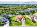 Beautifully landscaped home situated on a picturesque lot with serene water views and lush greenery at 13503 22Nd E Ct, Parrish, FL 34219