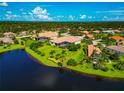 Aerial view of the property showcasing the expansive lawn and water view at 14714 5Th Ne Ter, Bradenton, FL 34212