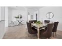 Dining room with a glass table and modern decor at 15344 Serene Shores Loop, Bradenton, FL 34211